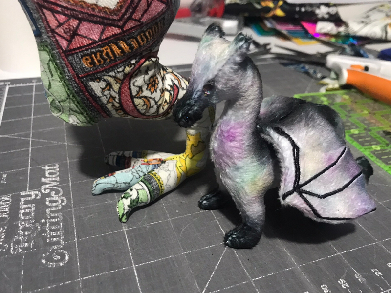 The original dragon plushie ankle-high to a muslin test of a much larger dragon