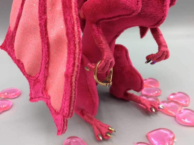 Closeup of the rainbow claws of an offensively fuchsia dragon