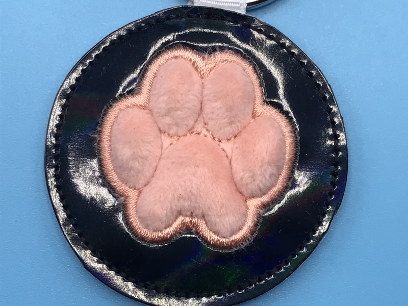 A puffy cat pawprint fob