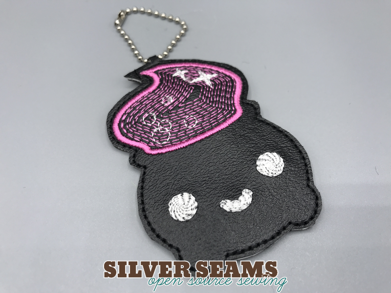 Happy little cauldron charm