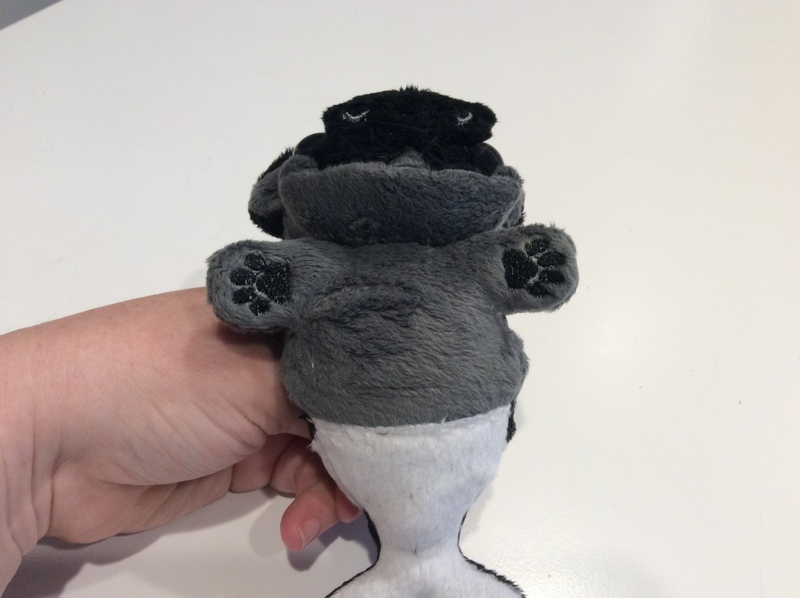 Underside of a plush pug/orca mermaid.