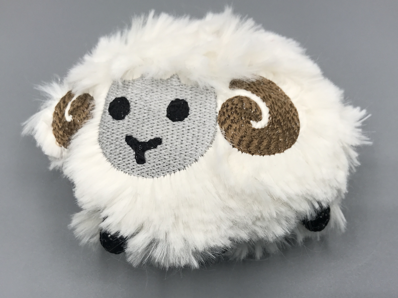 The Noto ram emoji, in fluffy plush form